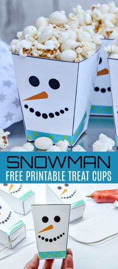 the snowman treat cups are filled with popcorn and marshmallows