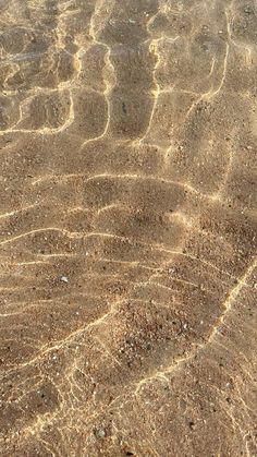 an image of sand and water that looks like it is in the ocean or on land