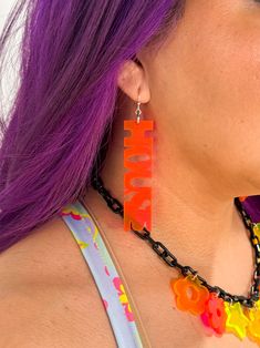 You're at a festival grooving with your friends and bumping to house (of course) Nomad Kandi original staple accessory Neon color are blacklight/ UV reactive Grab a House Choker to match Lightweight design Earring hooks are nickel free & hypoallergenic Charm designed and created in house Charm is approximately 3" length House Music Festival, House Earrings, Music Festival Accessories, Edm Fashion, Uv Reactive, Festival Accessories, Black Neon, Neon Color, Earring Hooks