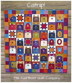 a colorful quilt with lots of cats on it