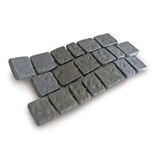 several pieces of gray stone sitting on top of each other in the shape of squares