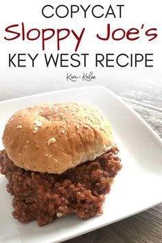 a sloppy joe's sandwich on a white plate with the words copycat sloppy joe's key west recipe