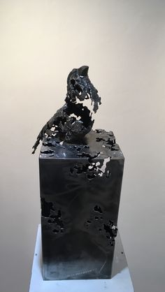 a sculpture is shown with black paint on it