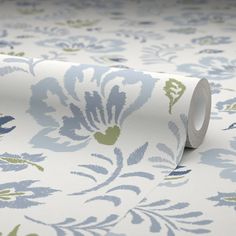 a roll of blue and green floral wallpaper