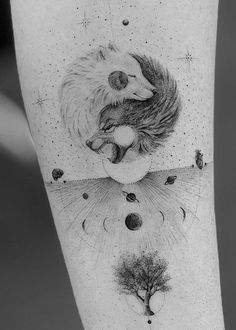 an arm tattoo with two animals on it and the moon in the sky above them