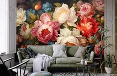 a living room with flowers painted on the wall