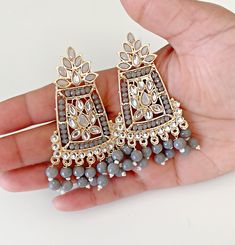 Grey dangal indian earrings. Party Tikka With Latkans For Navratri, Navratri Party Tikka With Latkans, Eid Party Tikka With Latkans, Elegant Beaded Earrings For Party And Festivals, Festive Dangling Beads Earrings For Celebration, Festive Beaded Drop Earrings For Celebration, Festive Drop Beaded Earrings For Celebrations, Festive Celebration Earrings With Dangling Beads, Festive Drop Beaded Earrings For Party