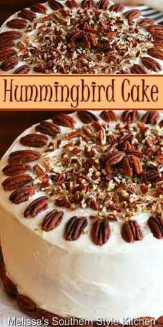 a hummingbird cake with pecans on top and the words hummingbird cake above it