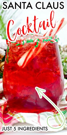 a red drink with candy canes in it and the words santa claus cocktail just 5 ingredients