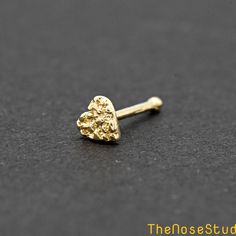 3.5mm Tiny Nugget Heart 14K Solid Gold Nose Bone Ball End Stud Metal: Solid 14K Yellow Gold Metal Stamp: 14K Finish: Polished Disc Size: 3.5mm Thickness: 0.6mm / 22 Gauge Post Length: 6mm Backing: Ball End Stud *Nickel FREE* It comes with a gift box. Ready for gifting Please read our shop policy before placing your order Thank you for visiting our shop Nose Piercing Unique, Nostril Stud, Stud Nose Piercing, Gold Nugget Jewelry, Nose Bone Stud, Xoxo Jewelry, Ysl Necklace, Crystal Jewelry Necklaces, Gold Nose Ring