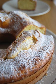 some powdered sugar covered donuts on a plate