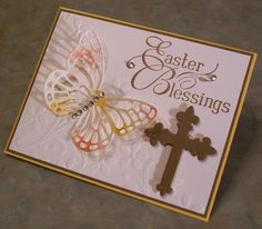 a greeting card with two butterflies and a cross on the front that says, easter blessing