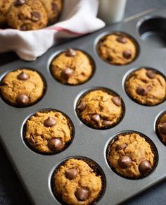 a muffin tin filled with chocolate chip cookies