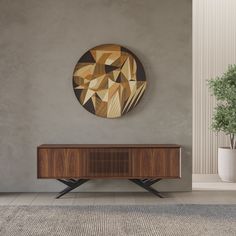 a wooden cabinet sitting in the middle of a room next to a potted plant