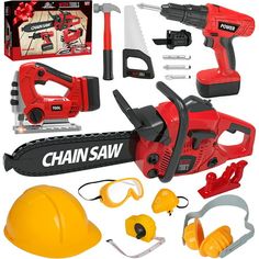 a red and black chainsaw with tools on top of it, including safety equipment