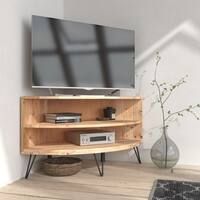 a flat screen tv sitting on top of a wooden shelf