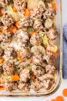 a casserole dish filled with meatballs and vegetables