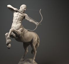 a statue of a man on a horse with a bow and arrow in his hand