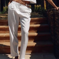 Dimensions: Waist: 33.0" Hips: 45.0" Inseam: 30.0" Composition: Outer Shell 50% Linen, 50% Viscose High Rise With Darts Pants. Linen Blend Pants. Front Pockets. Back False Welt Pockets With Buttons. Straight Leg. Belt Detail. Front Zip. Interior Button And Hook Closure. Elegant White Linen Pants, White Ankle-length Summer Pants, White Summer Ankle-length Pants, White Linen Ankle-length Bottoms, White Linen Pants For Spring, Chic White Tapered Leg Bottoms, White Fitted Linen Bottoms, White Linen Straight Pants, White High Waist Linen Bottoms