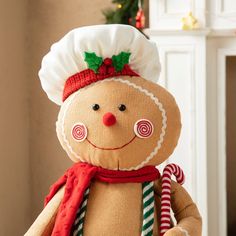 a stuffed toy with a chef's hat and candy canes