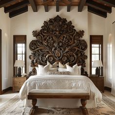 Elegant and sophisticated Mediterranean bedroom showcasing a grand, ornately carved headboard in a luxurious dark wood finish Mediterranean Apartment Decor, Mediterranean Interior Design Bedroom, Mediterranean Bedroom Design, Mediterranean Bedrooms, Mediterranean Bedroom Ideas, Laid Back Luxury, Mediterranean Bedroom, Mexican Interiors, Mediterranean Interior Design