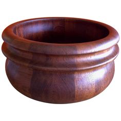 a wooden bowl is shown on a white background