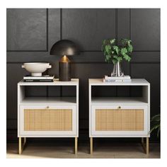 two white nightstands with wicker baskets on them and a plant in the corner