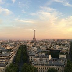 the eiffel tower towering over the city of paris, france at sunset or dawn