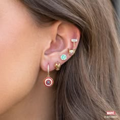 With our Marvel's Captain America Hoops, you can add some Super Hero style to your everyday look. The hoops feature Captain America's iconic shield, with vibrant red, white, and blue enamel detailing that's sure to make a statement. The glimmering stones that line the hoops add an extra level of chicness, making these Captain America Wedding, Marvel Earrings, Panther Earrings, Winged Helmet, Black Panther Necklace, Avengers Icon, Portrait Silhouette, Marvel Jewelry, God Of Thunder