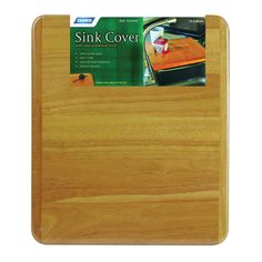 a wooden cutting board with an ad for sink cover on the front and back side