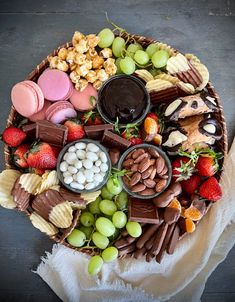 a basket filled with lots of different types of snacks and desserts on top of a table