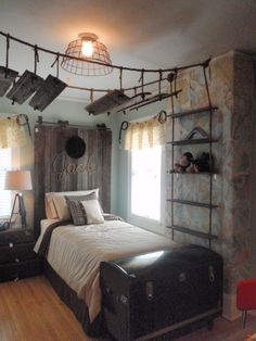 a bedroom with a bed, suitcases and shelves on the wall next to it