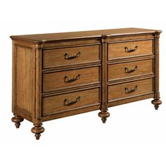 a large wooden dresser with drawers and knobs