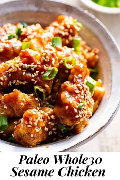 a bowl filled with sesame seed chicken