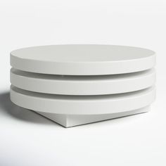 three white plates stacked on top of each other in front of a white background,