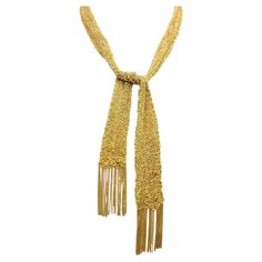 This exquisite 18 karat yellow gold mesh necklace is sure to become one of your new favorites. This versatile piece is unique, feminine and simply lovely. It can be dressed up or down and worn with just about anything- a perfect addition to your jewelry wardrobe. The chic, contemporary necklace is composed of finely knit 18 karat yellow gold mesh. Though delicate in construction, this piece makes a bold statement. The form is malleable and ergonomic in the way it drapes over the body's contours Mesh Necklace, Contemporary Necklace, Jewelry Wardrobe, Scarf Necklace, Tie Scarf, Elsa Peretti, Simply Lovely, Gold Accessories, Body Contouring