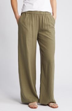 Cut from a breezy linen blend with a high waist and wide legs, these pull-on pants are a cool remake of a closet classic. 30" regular inseam; 25" leg opening; 11 12" front rise; 16" back rise (size Medium) 28" petite inseam; 24" leg opening; 11" front rise; 15" back rise (size Medium P) Elastic waist Front slant pockets; faux back welt pocket 55% linen, 45% rayon Machine wash, tumble dry Imported Women's Clothing Tropical Pants, Gauze Pants, Stylish Outfits For Women Over 50, Summer Pants Women, Linen Blend Pants, Summer Pants, Green Pants, Fashion Tips For Women, Wide Legs