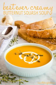 a bowl of butternut squash soup on a table