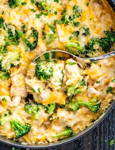 broccoli and chicken casserole in a skillet with a serving spoon