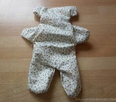 an infant's diaper laying on top of a wooden floor