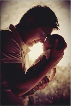 a man holding a baby in his arms with the caption saying happy father's day