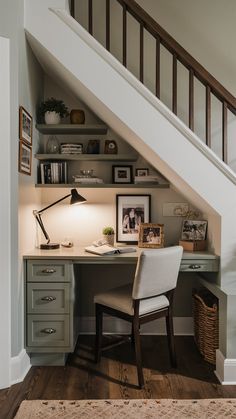 a home office under the stairs with a desk and chair