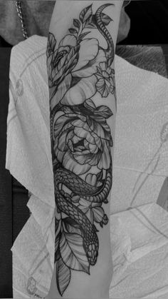 Snake Lower Arm Tattoo, Flowers With Snake Tattoo, Upper Arm Snake Tattoos For Women, Snake With Plants Tattoo, Forearm Snake Tattoo Women, Snake And Flowers Tattoo Arm, Snake In Flowers Tattoo, Snake Forearm Tattoo Women, Body Wrap Tattoo