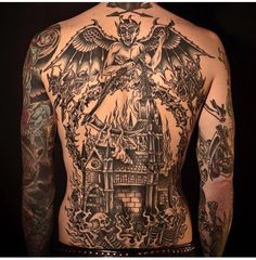 a man with lots of tattoos on his back