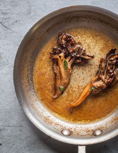 some food is cooking in a pan on the table and it looks like they have been cooked