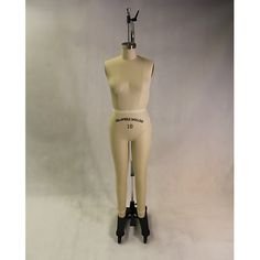 a mannequin is standing on top of a stand