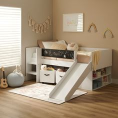 a child's bedroom with a slide in the corner