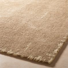 a beige area rug on the floor with no one in it or someone out there