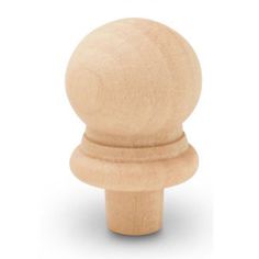 an unfinished wooden knob on a white background