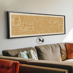 a living room filled with furniture and a painting on the wall